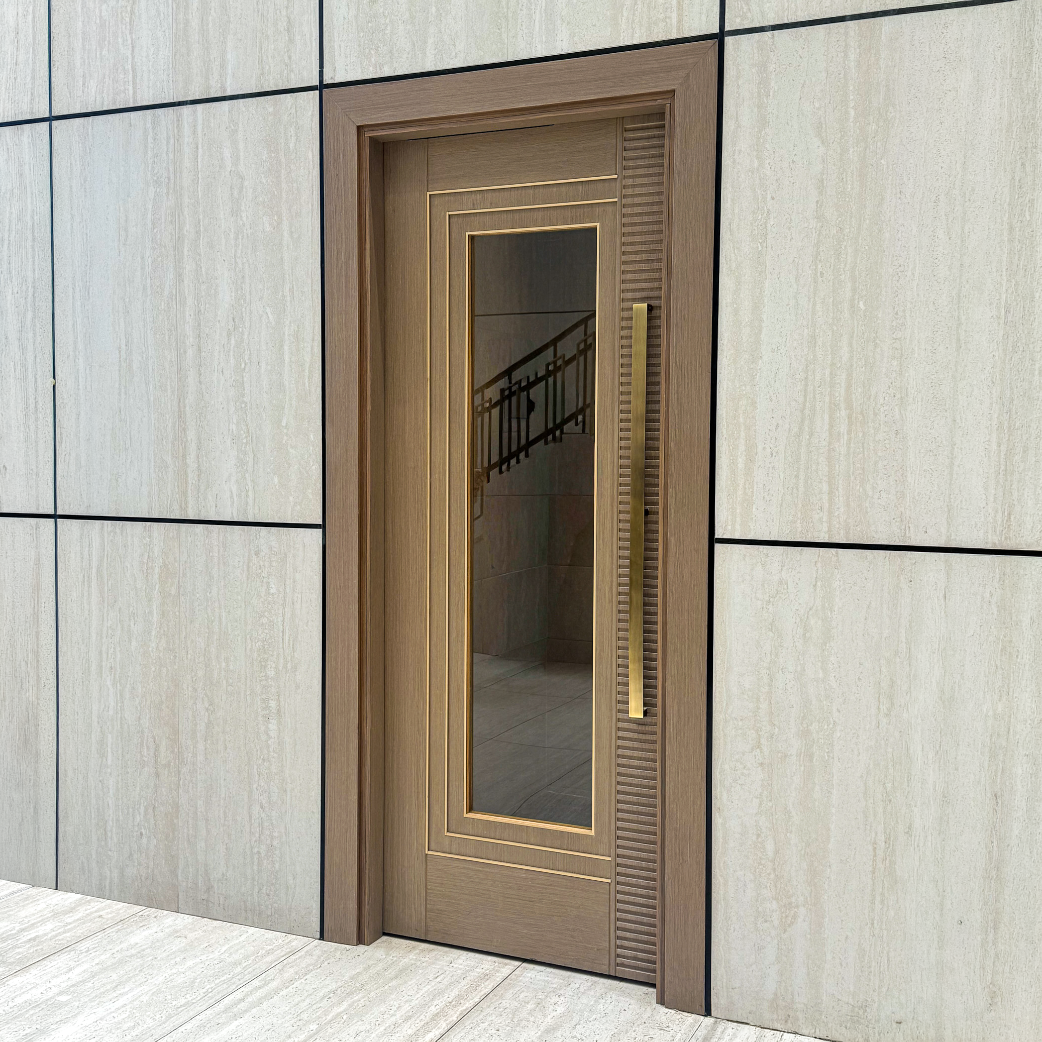 Oak veneer synagogue door with brass inlay, textured glass panel and custom brass pull handle, made by LK Doors and Interiors for a synagogue in New York