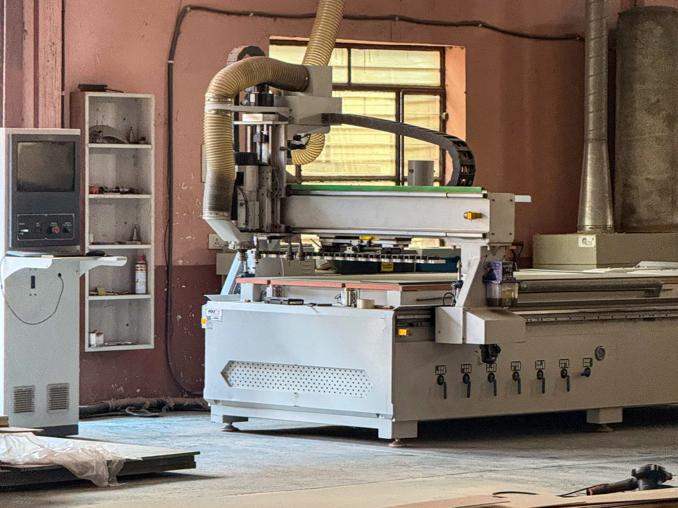 ATC CNC router with automatic tool changer and vacuum bed, cutting doors to drawing at the LK Doors and Interiors factory in Bhiwadi