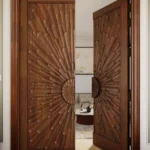 LK 146 solid wood double door with carved sunburst petal rays from a central rosette, shown half open, by LK Doors and Interiors