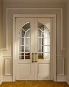 LK 609-H white HDHMR double door with arched glass grid and brass handles, by LK Doors and Interiors
